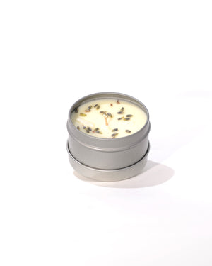 lavender scented candle with dried herbs in metal tin